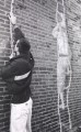Brian climbs the wall.